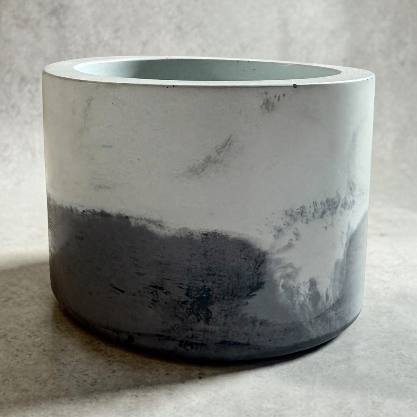A black/blue colored marbled vessel