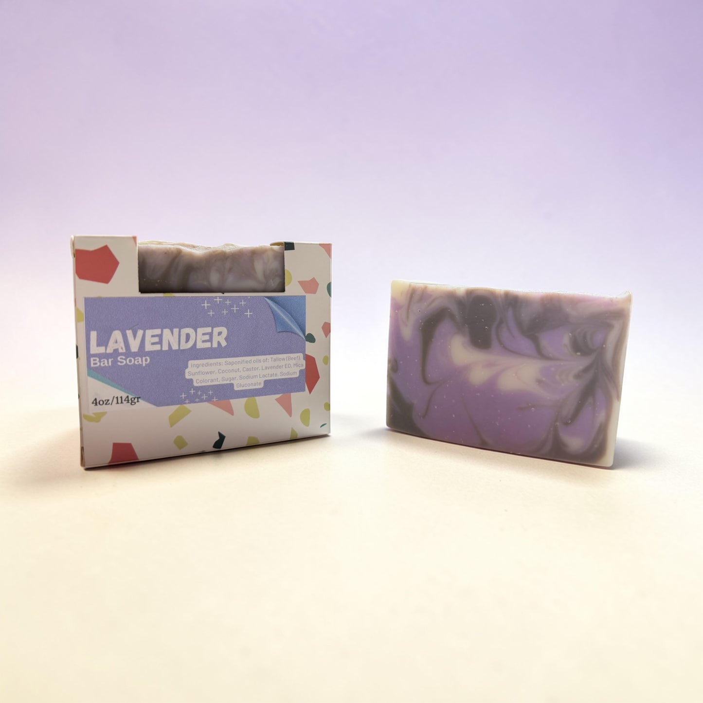 Lavender bar soap with packaging on a light purple background