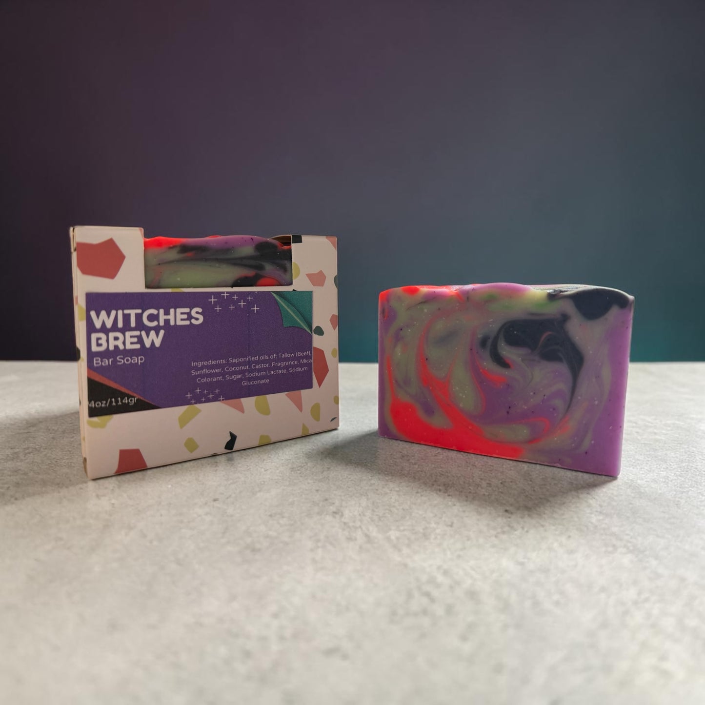 Colorful bar soap with packaging labeled 'Witches Brew' on a textured surface.