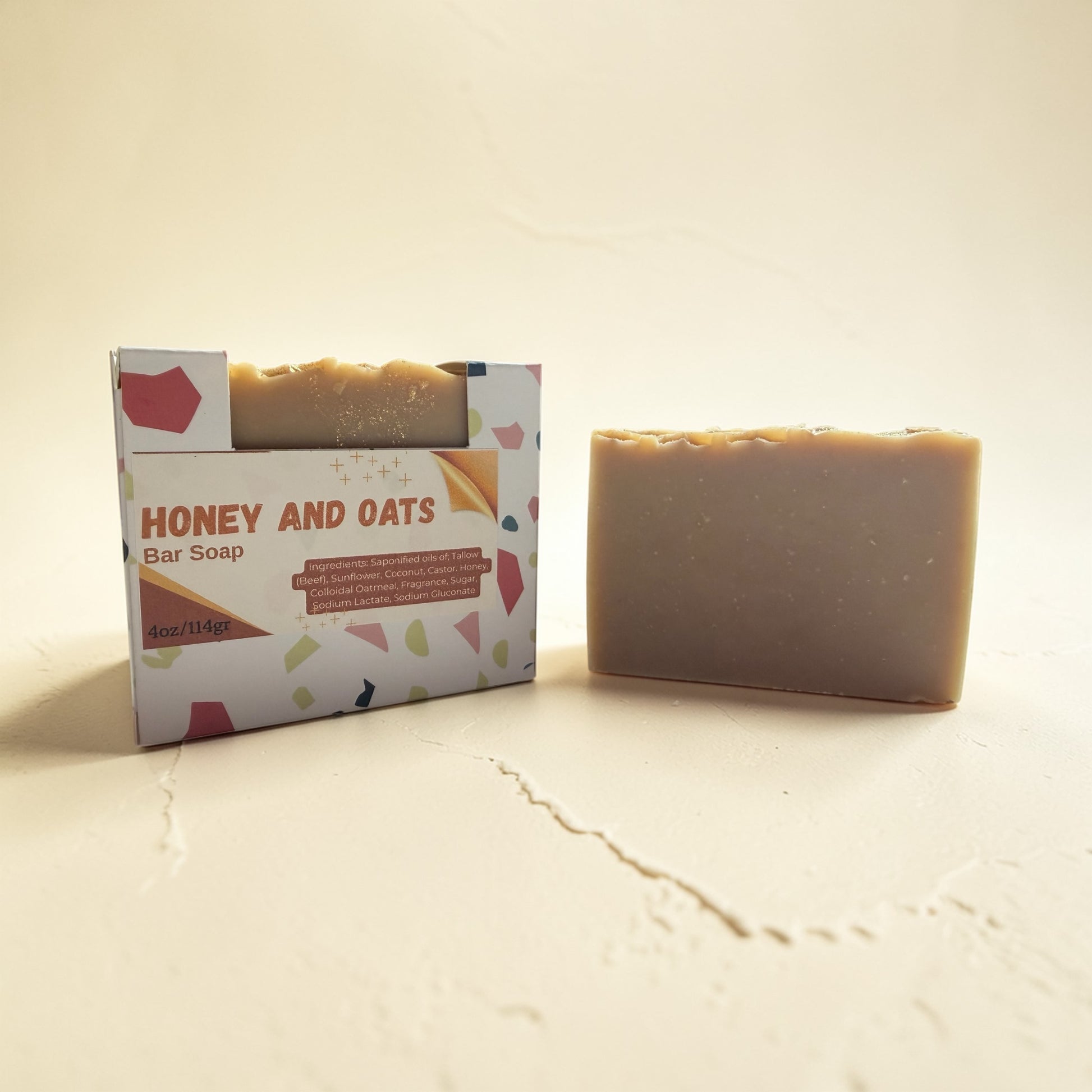 Bar of soap with packaging labeled 'Honey and Oats' on a beige background