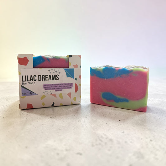 Colorful bar soap with a box labeled 'Lilac Dreams' on a light background