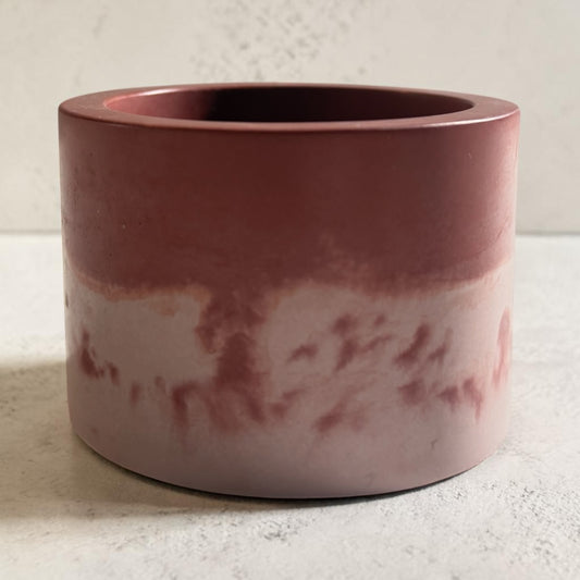 A rose colored marbled vessel