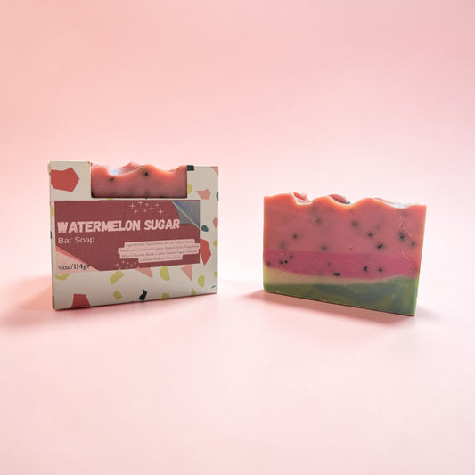 Watermelon sugar bar soap with packaging on a pink background
