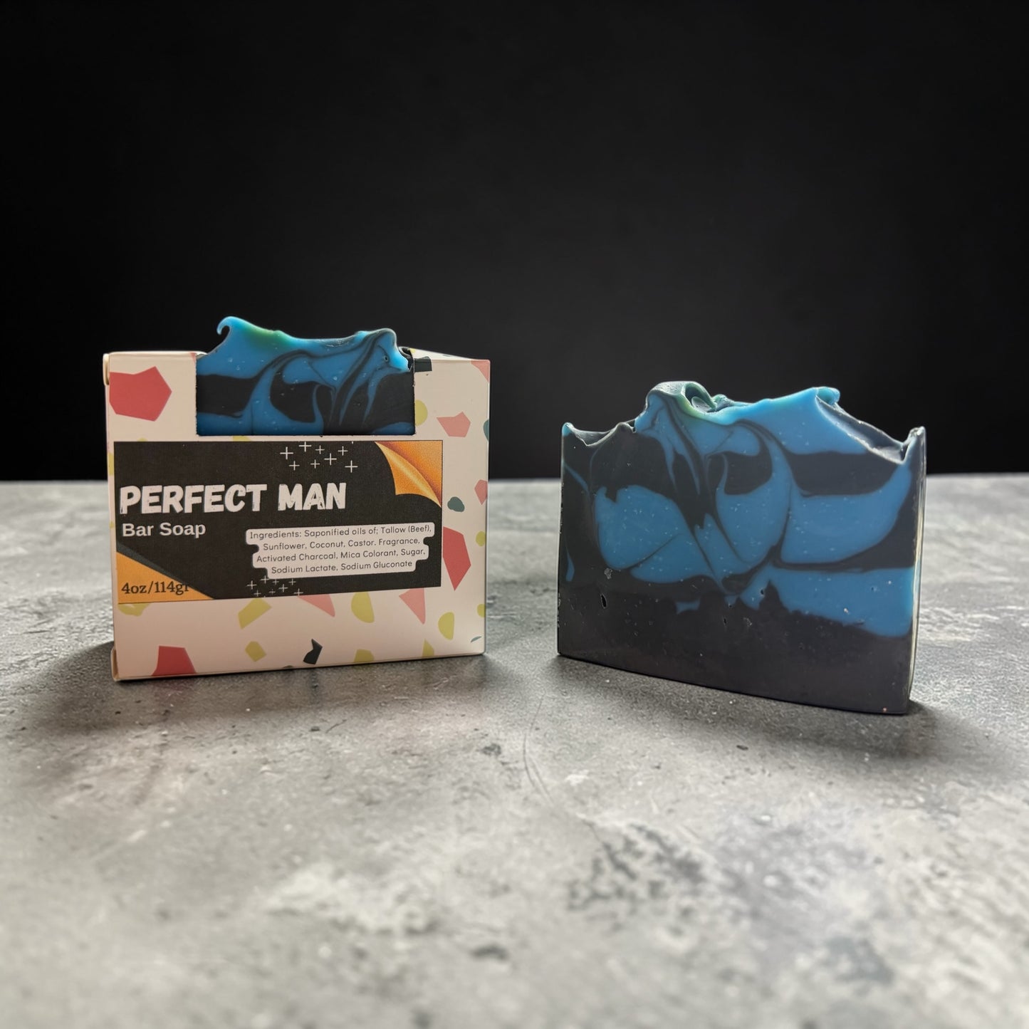 Bar of soap with a colorful packaging labeled 'Perfect Man' on a gray surface.