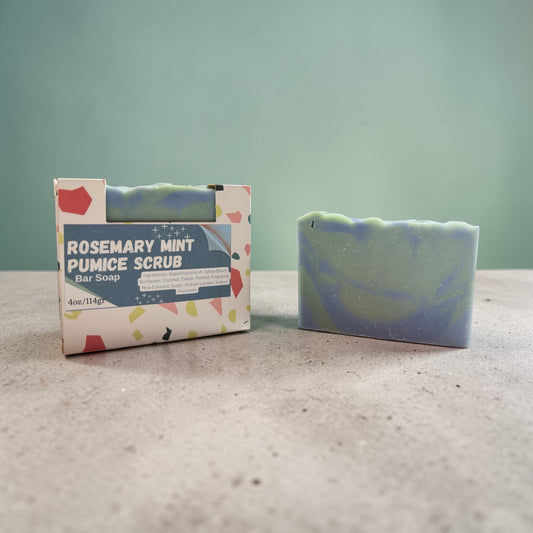 Rosemary Mint Pumice Scrub bar soap with packaging on a neutral background