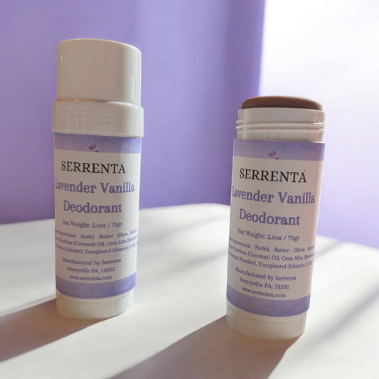 Two Serrenta Lavender Vanilla Deodorants on a white surface with a purple background